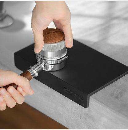 MHW-3BOMBER wood-topped tamper used at the black flat A-style mat; tamper separate