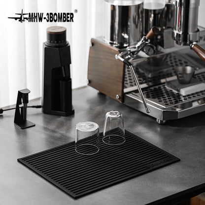 MHW-3BOMBER SP5326B Black dish drying pad with two inverted glasses; pictured tools and equipment not included.
