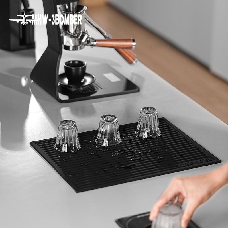 MHW-3BOMBER SP5326B Black dish drying pad with three inverted glasses; pictured tools and equipment not included.