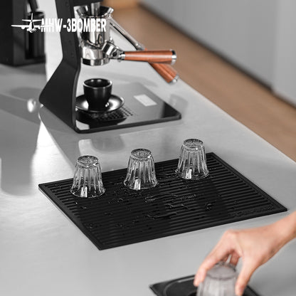 MHW-3BOMBER SP5326B Black dish drying pad with three inverted glasses; pictured tools and equipment not included.