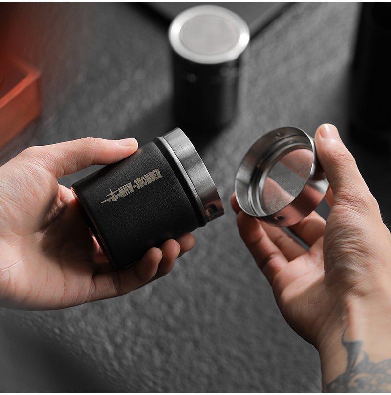 MHW-3BOMBER SP5366B matte black shaker held while opening its lid