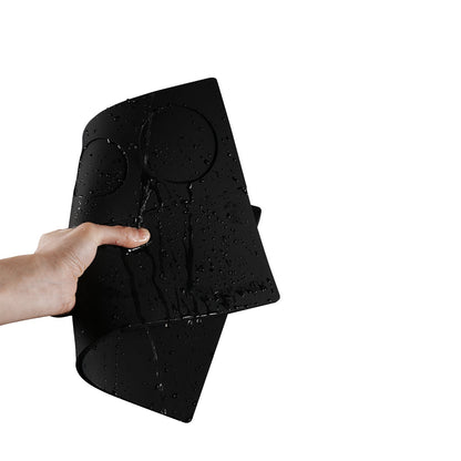 MHW-3BOMBER SP5538 Black recessed Yu tamping mat held wet during a cleaning demonstration; one mat only.
