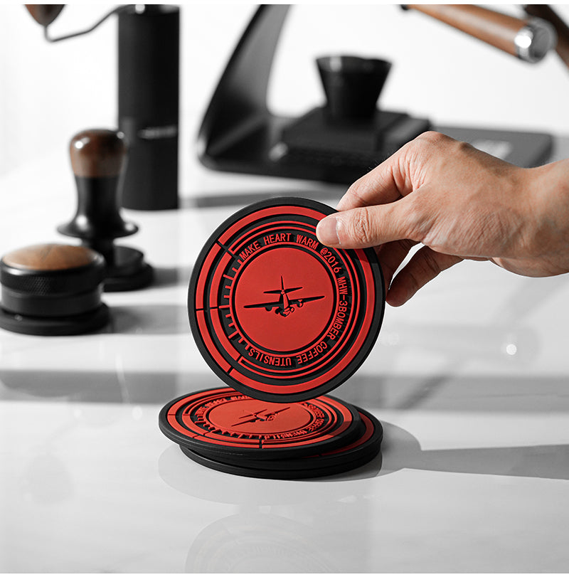 MHW-3BOMBER round silicone mat held in the hand