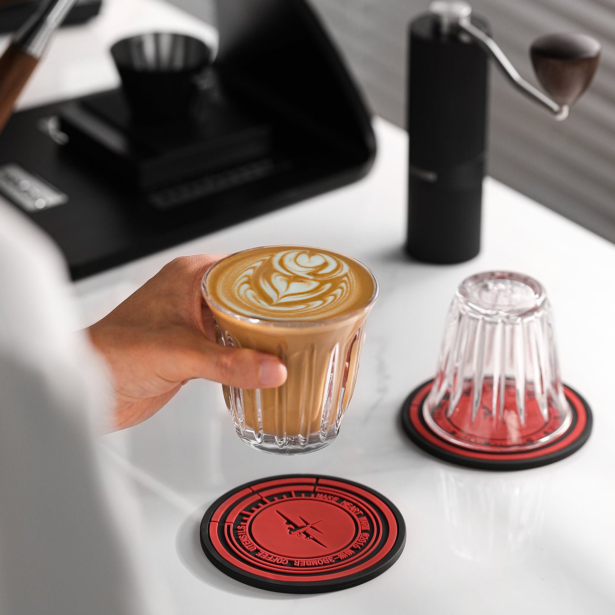 MHW-3BOMBER coffee cup positioned at a silicone mat; cup separate