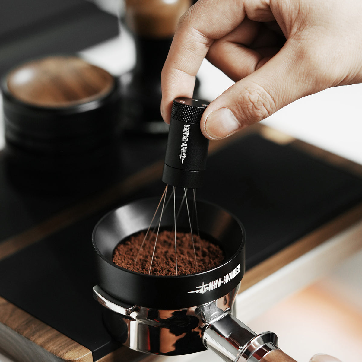 MHW-3BOMBER Lightning 2.0 needles working through coffee grounds; portafilter not included