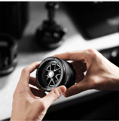 MHW-3BOMBER wheel-style top of the Yu distributor viewed in the hands