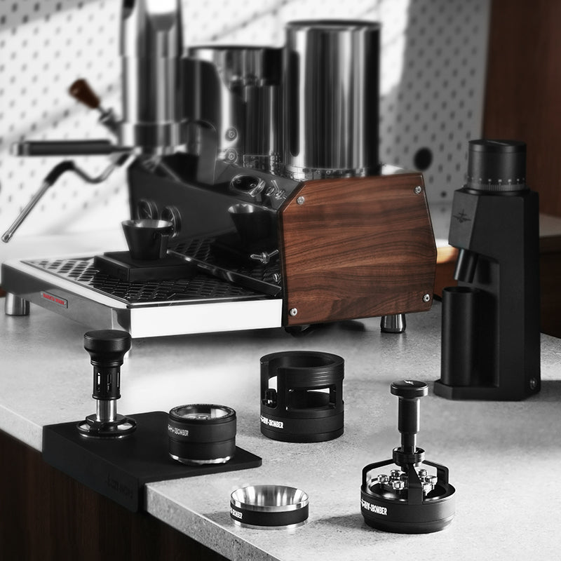 MHW-3BOMBER T5848 58.35 mm Yu stepless distributor on a coffee counter; separate tamper, cyclone tool, holder and machine not included