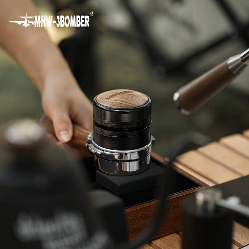 MHW-3BOMBER T6096 distributor seated on an espresso portafilter