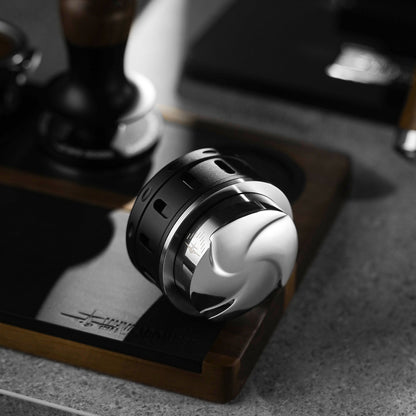 MHW-3BOMBER T6097 Falcon 58.35 mm distributor underside on a coffee counter; holder and tamper not included