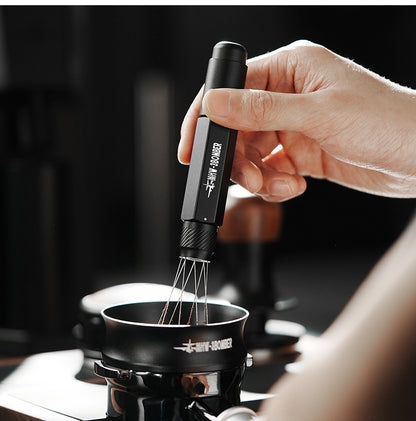 MHW-3BOMBER Lightning WDT Tool Pro T6188B Stellar Black with extended needles above a portafilter; scene props and extra tools are not included