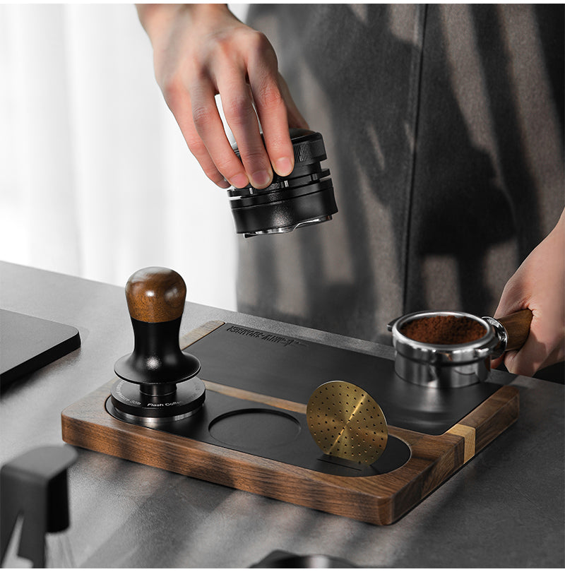 MHW-3BOMBER wood tamping base supporting a portafilter during preparation; portafilter separate