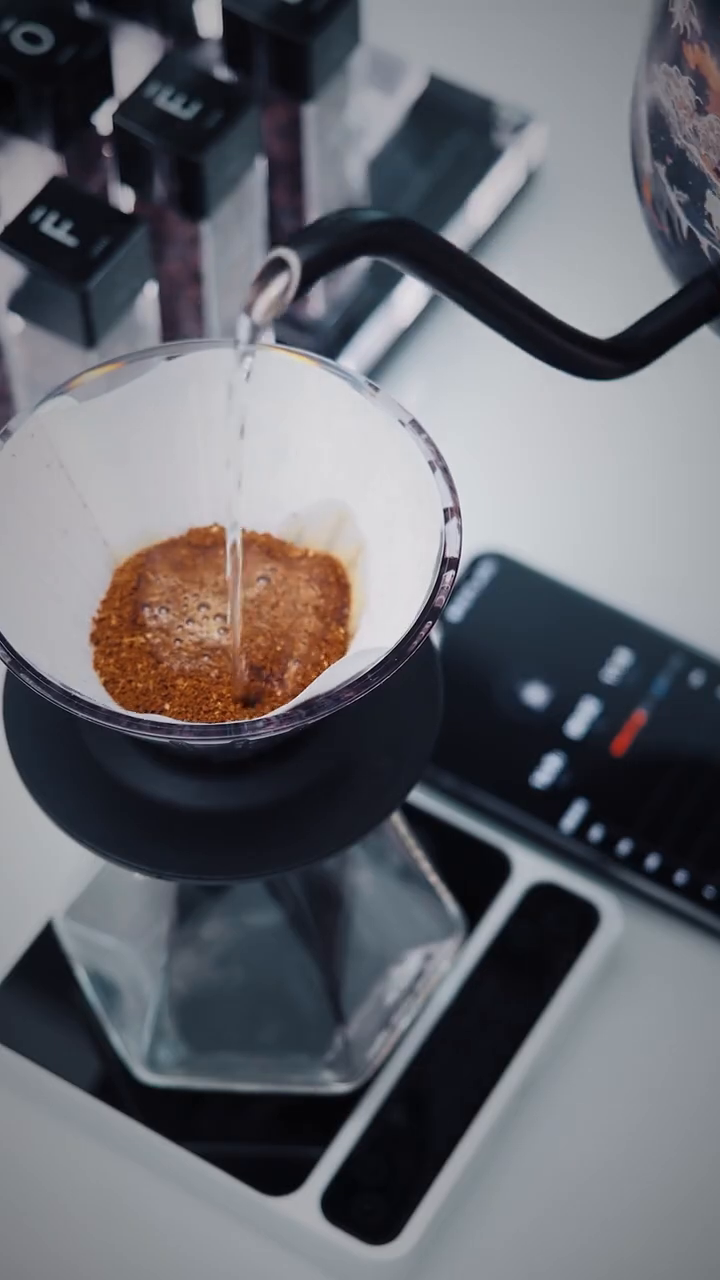IKAPE V2 Pro silver scale in overhead pour-over operation with app; separate brewing equipment is not included