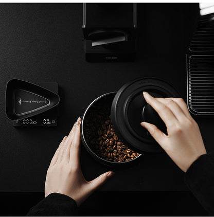 MHW-3BOMBER VC6033 lid lifted above a canister of coffee beans