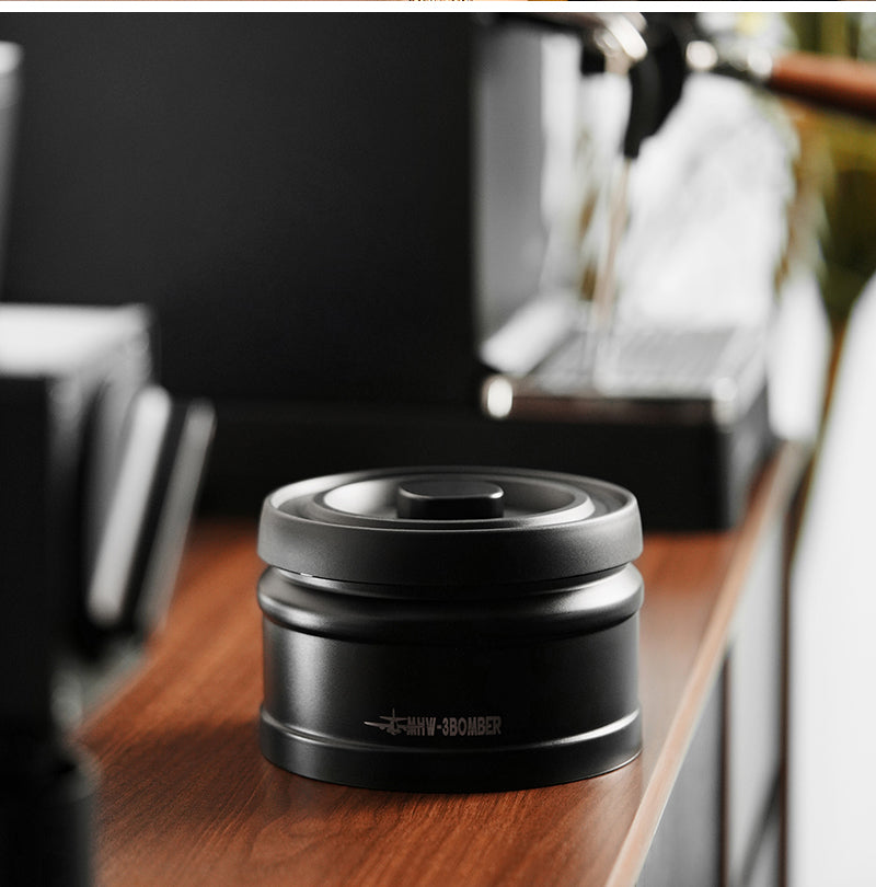 MHW-3BOMBER VC6033 closed black canister on a wooden counter