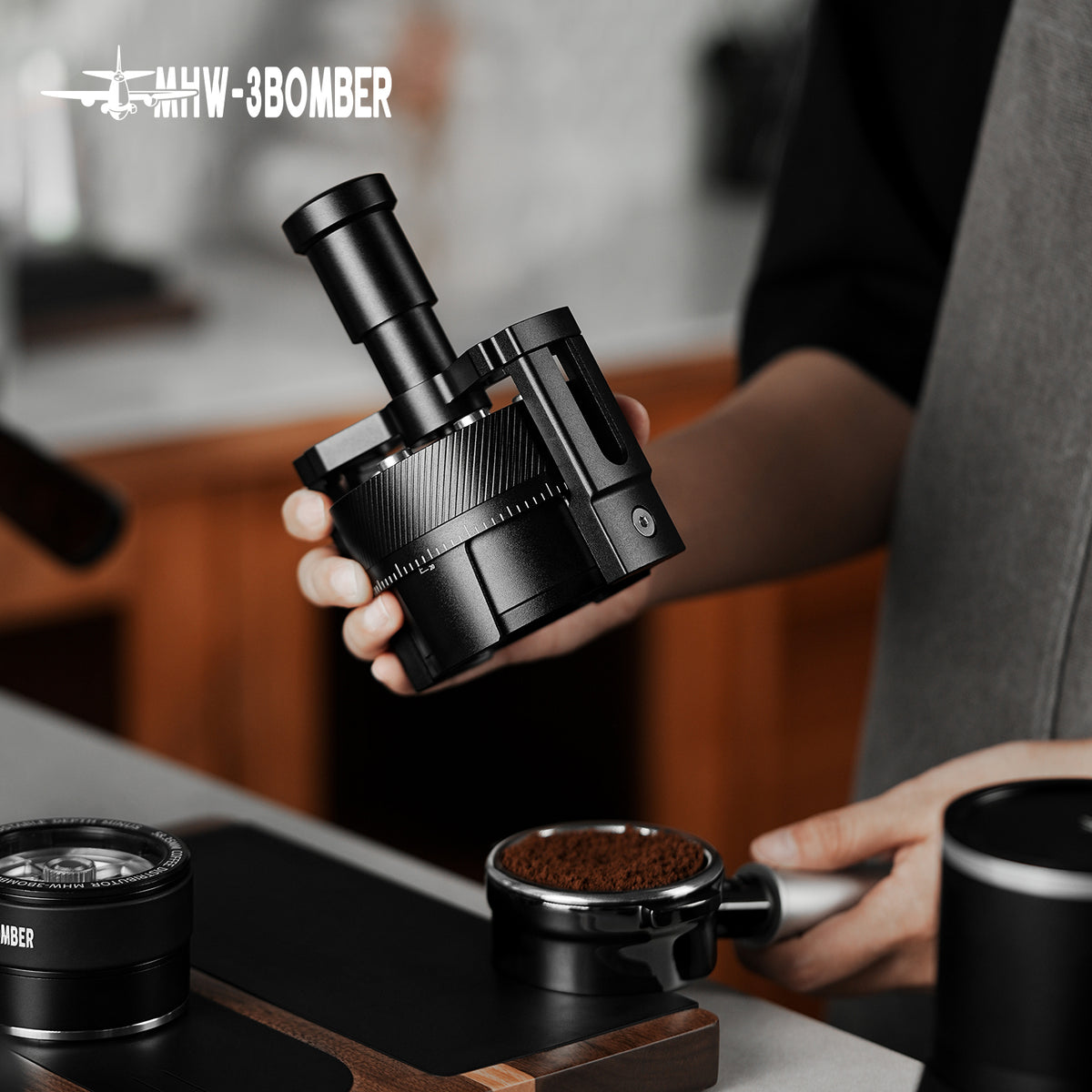 MHW-3BOMBER T5579 SE Pro WDT tool held above a coffee basket