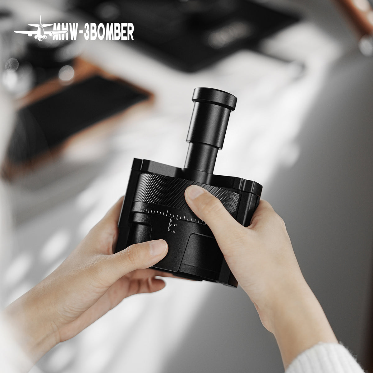 MHW-3BOMBER T5579 SE Pro WDT tool held with both hands
