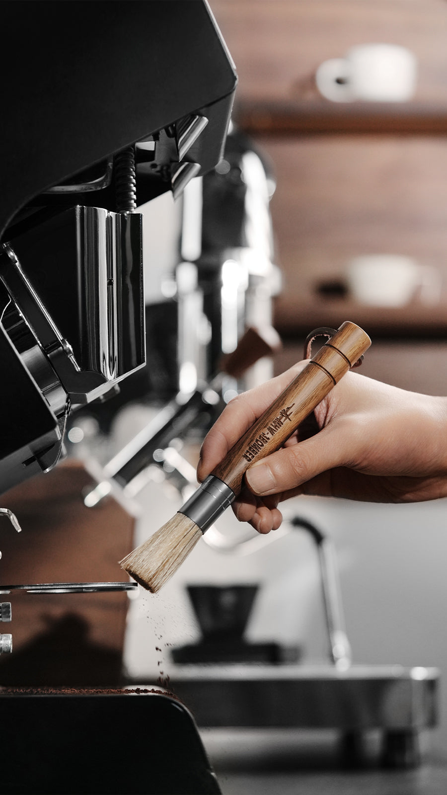 MHW-3BOMBER Wings brush held below a coffee grinder